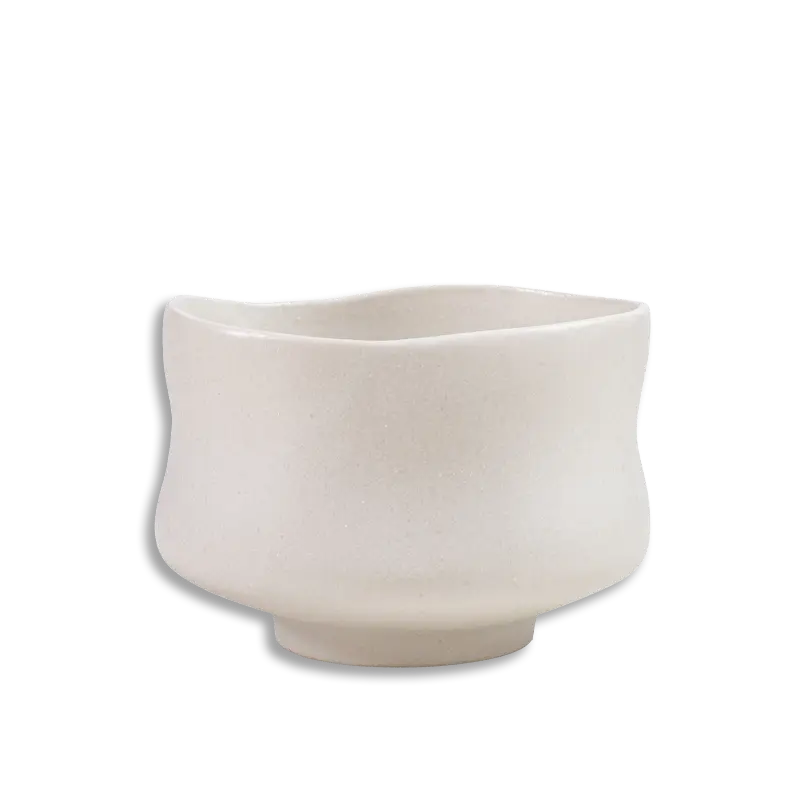 Beige ceramic planter on a white background