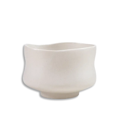 Beige ceramic planter on a white background