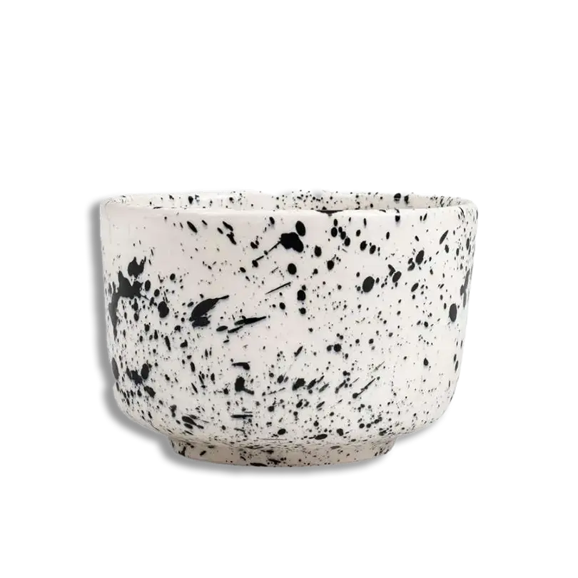Speckled ceramic bowl on a white background