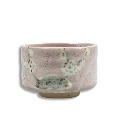 Ceramic cup with a speckled design on a white background