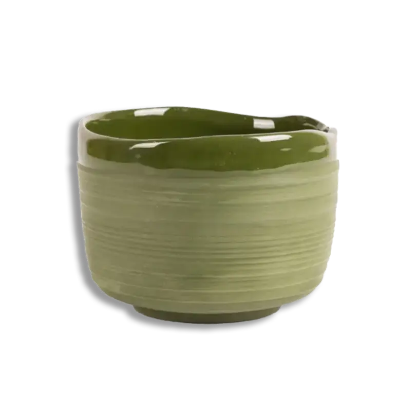 Green ceramic planter on a white background